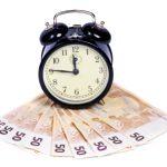 Wecker und Geldschein - Zeit ist Geld